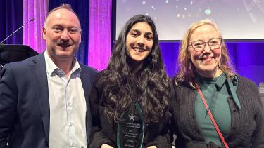 Superintendent Nosek and Chair Wilson, stand with Abby Schools student who won an award at the Cultural Diversity Awards