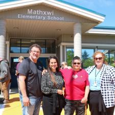 Board chair, District Vice Principal, President of FV Metis association and Assistant Superintendent pose together in front of school
