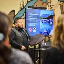 Male drummer from Mathxwi First Nation opens the luncheon with a song